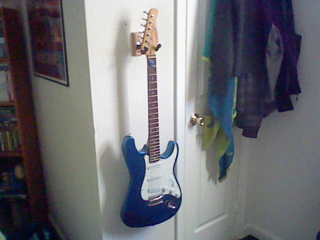 Guitar hanging up on my wall