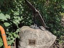 An eagle statue on top of a rock