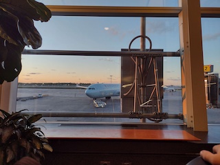 A nice sunset at the Montreal airport and a plane about to take off