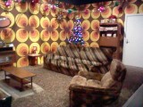 The gloriously bad fake 70s living room