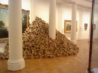 A big pile of cardboard birdhouses