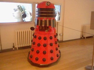 A red Dalek miniature