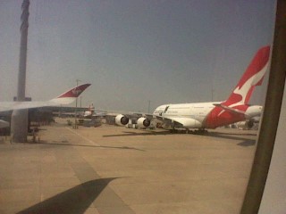 A few Virgin Airlines planes on the tarmac