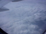 Plane shot, cloud cover visible