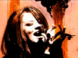 Stupid Girl: Shirley Manson sings into a microphone sensually behind distorted filmstock