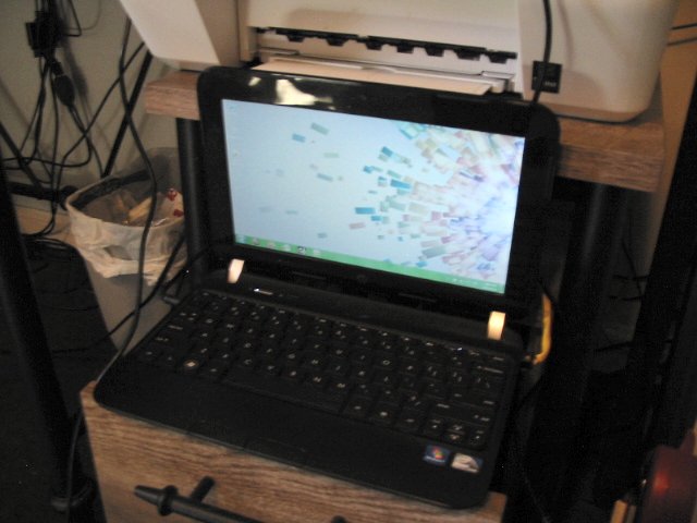 The HP Mini awkwardly pulled out of the shelf I keep it on