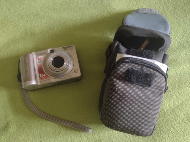 My PowerShot next to its carrying case with manual inside