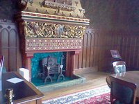 The lower half of the fireplace in the small dining room