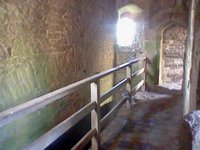 A fenced walkway over what I believe to be a waste tunnel of some kinda